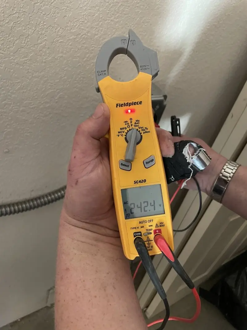 Voltage testing with clamp meter during Outlet Installation in Montclair